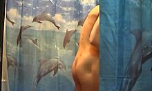 Slim teenage girl shows her naked body in the shower and turns back to the viewer with her back naked